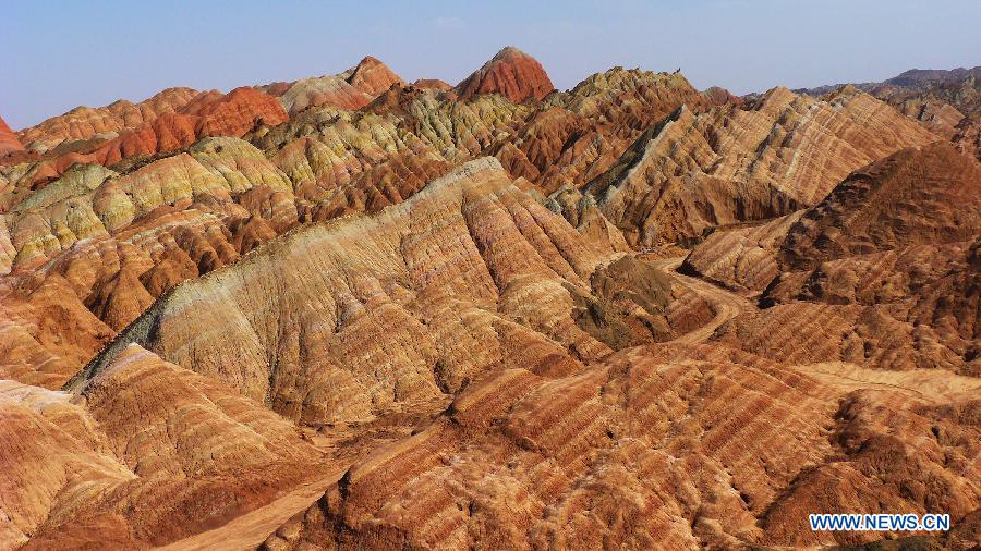 Photo taken on April 1, 2013 shows a scenic view of Danxia Landform in Zhangye City, northwest China's Gansu Province. Danxia is a special landform from reddish sandstone that has been eroded over time into a series of mountains surrounded by curvaceous cliffs and many unusual rock formations. (Xinhua/Shi Youdong)