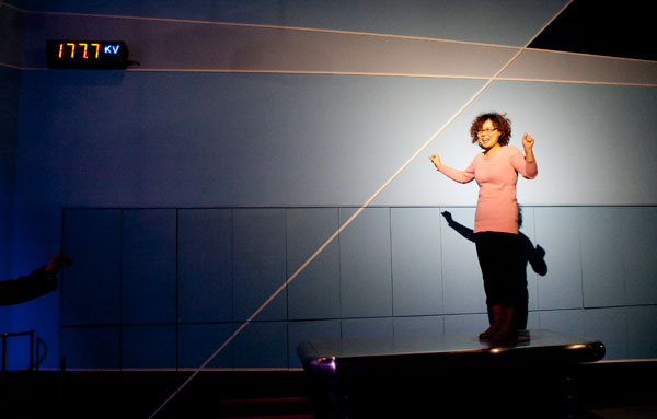 A woman stands electrified in a demonstration at the China Science and Technology Museum.   [Photo: CRIENGLISH.com/William Wang]