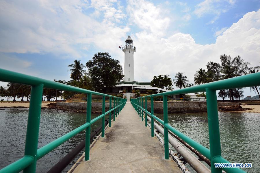 Photo taken on April 2, 2013 shows the Raffles Lighthouse on Singapore's southern island of Pulau Satumu. The Maritime Port Authority (MPA) of Singapore organized a visit for the media to the Raffles Lighthouse as a preview of the upcoming Singapore Maritime Week which will be held from April 7 to 12. (Xinhua/Then Chih Wey)