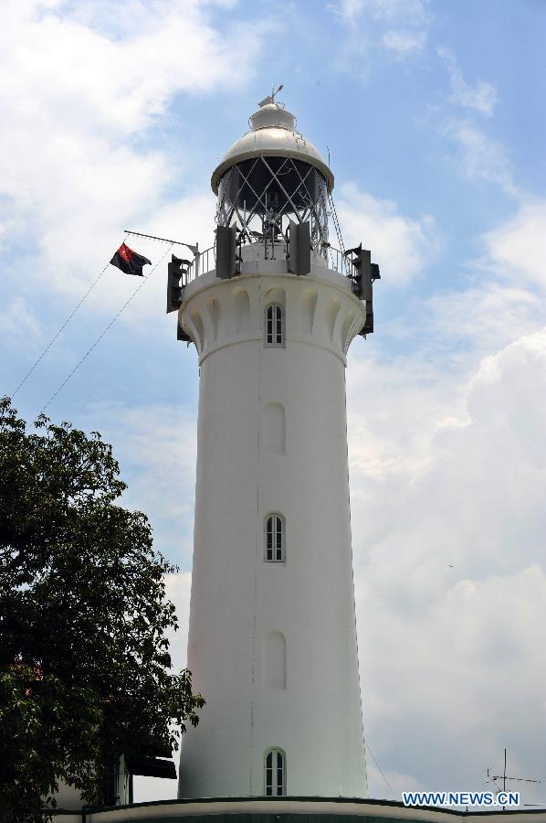 Photo taken on April 2, 2013 shows the Raffles Lighthouse on Singapore's southern island of Pulau Satumu. The Maritime Port Authority (MPA) of Singapore organized a visit for the media to the Raffles Lighthouse as a preview of the upcoming Singapore Maritime Week which will be held from April 7 to 12. (Xinhua/Then Chih Wey)