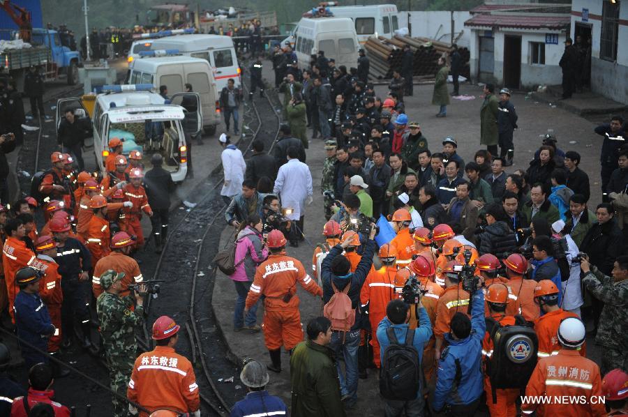 A rescued miner is carried to an ambulance at a flooded coal mine in Weng'an County, southwest China's Guizhou Province, April 8, 2013. Three miners trapped in the flooded Yunda Coal Mine for about 60 hours were rescued early Monday morning. Three others remained missing at the mine, which was hit by flood last Friday. Rescuers had earlier confirmed that three miners had been dead. (Xinhua/Liu Xu)