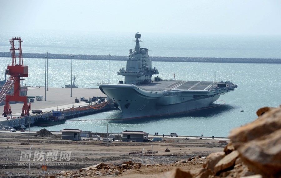 China's first aircraft carrier, the Liaoning, anchors at a military port. (Photo source: www.mod.gov.cn)
