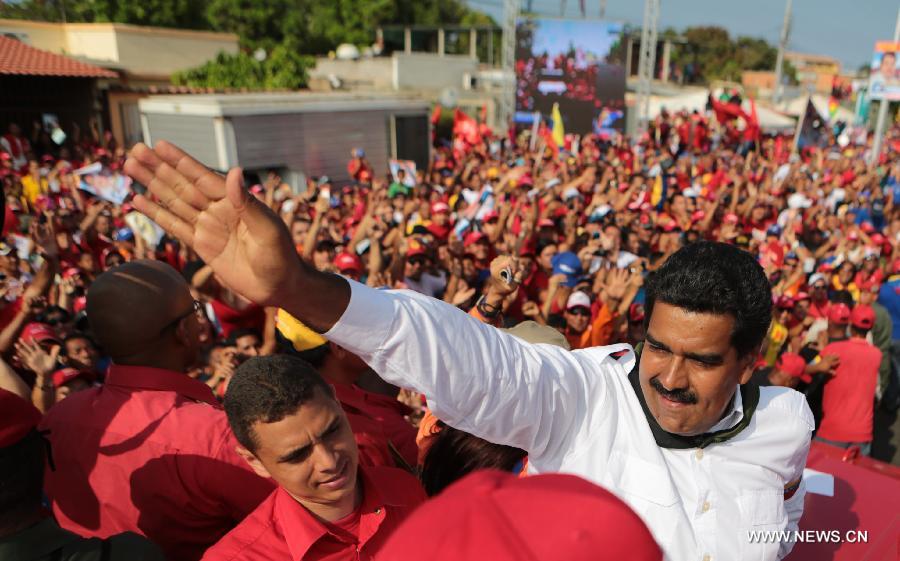 Image provided by Hugo Chavez Campaign Command shows Venezuelan Acting President and presidential candidate Nicolas Maduro (R) attending a campaign in Sucre State, Venezuela, on April 8, 2013. Venezuela will held presidential elections on April 14. (Xinhua/Hugo Chavez Campaign Command) 