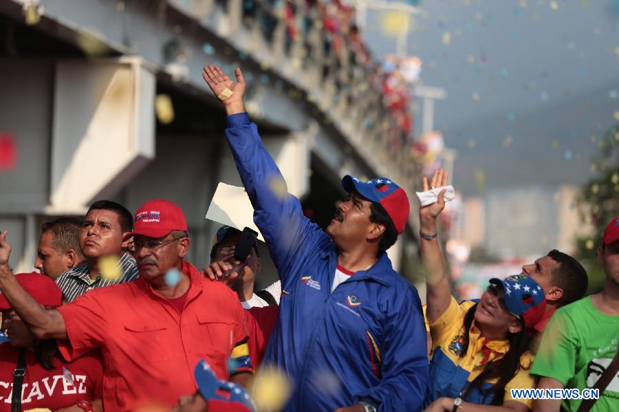 Image provided by Hugo Chavez Campaign Command shows Venezuelan Acting President and presidential candidate Nicolas Maduro attending a campaign rally in Vargas state, Venezuela, on April 9, 2013. Venezuela will hold presidential elections on April 14.(Xinhua/Hugo Chavez Campaign Command)
