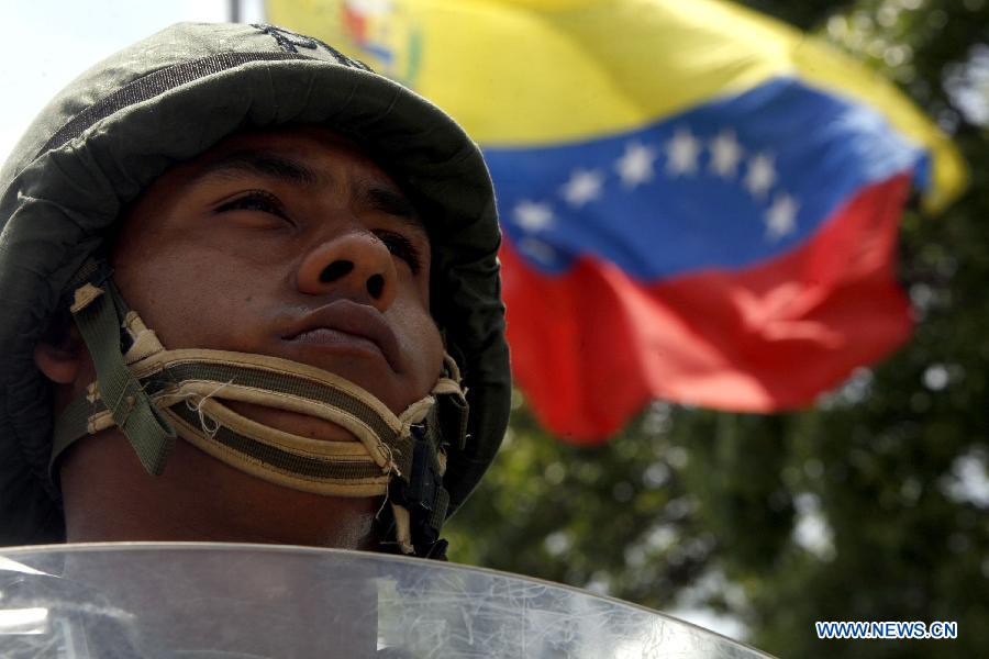 A soldier takes part in the Republic Plan, prior to the Venezuelan presidential elections, in Caracas, capital of Venezuela, on April 10, 2013. Venezuela will hold presidential elections on April 14. The Republic Plan is held to guarantee the security on the presidential electoral process. (Xinhua/AVN) 