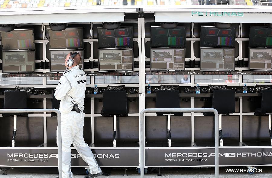 A crew member of Mercedes prepares before the first practice session of the Chinese F1 Grand Prix at the Shanghai International circuit, in Shanghai, east China, on April 12, 2013. (Xinhua/Li Ming)