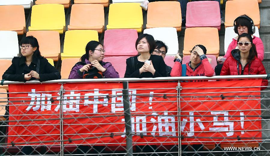 Audience display a banner supporting Caterham's driver Ma Qinghua of China during the first practice session of the Chinese F1 Grand Prix at the Shanghai International circuit, in Shanghai, east China, on April 12, 2013. (Xinhua/Li Ming)