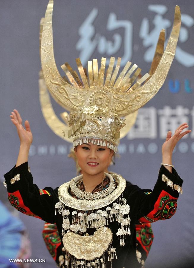 A model presents a costume of the Miao ethnic group at the Guangxi Museum of Nationalities in Nanning, capital of south China's Guangxi Zhuang Autonomous Region, April 12, 2013. A total of 210 set of traditional costumes of the Miao ethnic group went on display here on Friday. Costumes of the Miao ethnic group is well known for its fine craftsmanship, brilliant colors, various styles and rich cultural connotations. (Xinhua/Lu Boan)