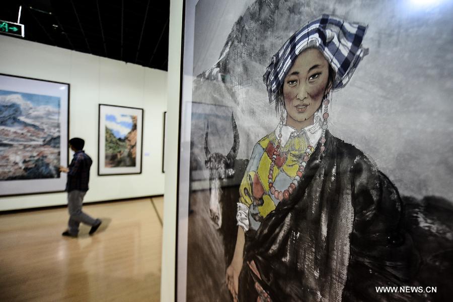 A visitor views works at an exhibition commemorating the third anniversary of the Yushu earthquake, at the Qinghai Provincial Museum in Xining, capital of northwest China's Qinghai Province, April 14, 2013. A 7.1-magnitude earthquake hit Yushu on April 14, 2010, leaving 2,698 dead and over 12,000 injured.(Xinhua/Wu Gang)  