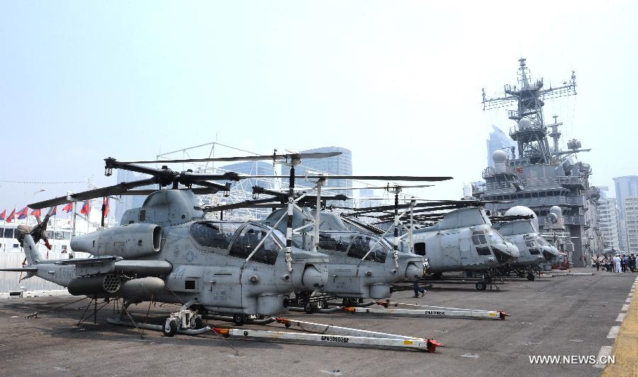U.S. navy helicopters are pictured on the USS Peleliu, the flagship of the Amphibious Squadron Three, in Hong Kong, south China, April 15, 2013. Three ships of the U.S. navy Amphibious Squadron Three started to make a port visit in Hong Kong on Monday to get replenishment. USS Peleliu pulled into the Ocean Terminal besides Tsim Sha Tsui, on the northern bank of the landmark Victoria Harbor in the morning. The other two ships anchored in waters outside the Harbor. (Xinhua/Wong Pun Keung) 