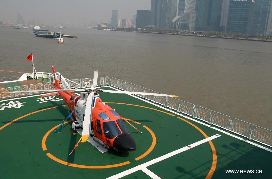 A helicopter is pictured on the patrol vessel Haixun01 in Shanghai, east China, April 15, 2013. Haixun 01, soon to be put into service and managed by the Shanghai Maritime Bureau, is China's largest and most advanced patrol vessel. The 5,418-tonnage Haixun01 is 128.6 meters in length and has a maximum sailing distance of 10,000 nautical miles (18,520 km) without refueling. It will carry out missions regarding maritime inspection, safety monitoring, rescue and oil spill detection and handling. (Xinhua/Ding Ding) 