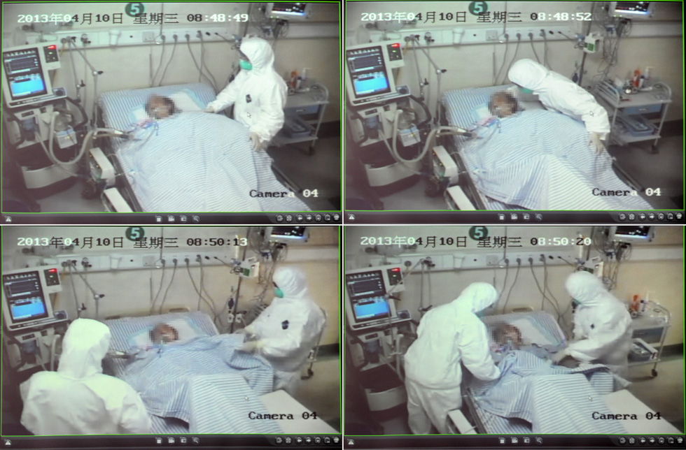 Screenshots of the hospital’s surveillance video show doctors and nurses are in the treatment of a H7N9 bird flu patient in Zhengjiang province on April 10, 2013. (Photo by Ju Huanzong/ Xinhua) 