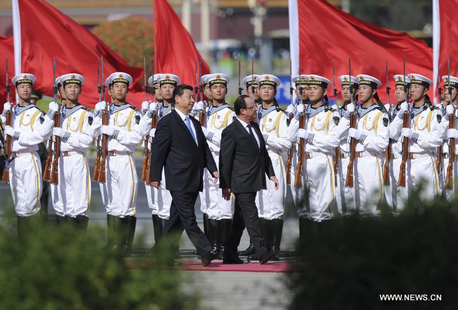 Chinese President Xi Jinping (L Front) holds a welcoming ceremony for French President Francois Hollande (R Front) in Beijing, capital of China, April 25, 2013. (Xinhua/Xie Huanchi)