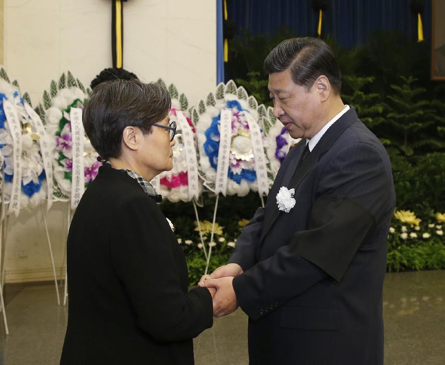 Chinese President Xi Jinping (R) condoles with a family member at the memorial service of Ni Zhifu, a former member of the Political Bureau of the Communist Party of China (CPC) Central Committee and former president of the All China Federation of Trade Unions (ACFTU), in Beijing, capital of China, May 2, 2013. Ni died at the age of 79 on Wednesday last week. (Xinhua/Ju Peng)  