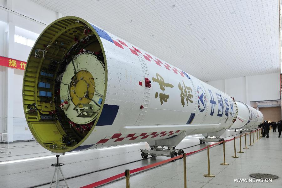 The first and second stage launchers of the Long March 2-F rocket which will carry China's new manned spacecraft Shenzhou-10 are placed at the Jiuquan Satellite Launch Center for further test in Jiuquan, northwest China's Gansu Province, May 3, 2013. The Long March 2-F rocket was delivered to the center on May 2 and it is technologically advanced and more reliable compared to the one that carried the Shenzhou-9. Shenzhou-10, scheduled to blast off early next month, was delivered to the launch center in northwest China on March 31. (Xinhua/Liang Jie) 