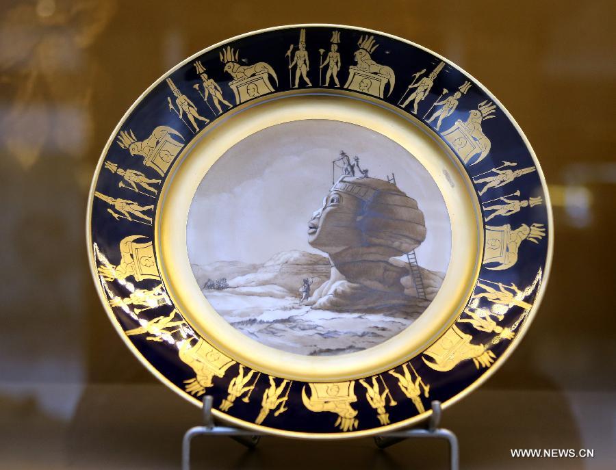 Photo taken on May 4, 2013 shows a porcelain plate made in the 19th century displayed in an exhibition of "Splendour of the French Table" in Hong Kong, south China. As one of the activities of "French May", the exhibition which will last till June 9 presents tableware from leading French historical manufactures and luxury maisons since the 18th century. (Xinhua/Li Peng) 