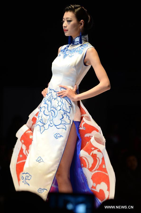 A model presents fashion creation designed by Gao Lixin during the 2013 China (Qingdao) International Fashion Week in Qingdao, a coastal city in east China's Shandong Province, May 5, 2013. (Xinhua/Li Ziheng) 