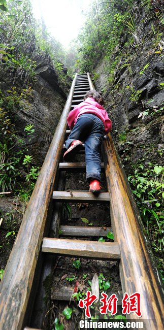 Zhangjiawan village is located on a remote mountain called “The Gate of Heaven” in central China's Hunan province, accessible only by ladders. The town was built hundreds of years ago to avoid bandits. Children here literally climb mountains to get to school. (Source: chinenews.com)