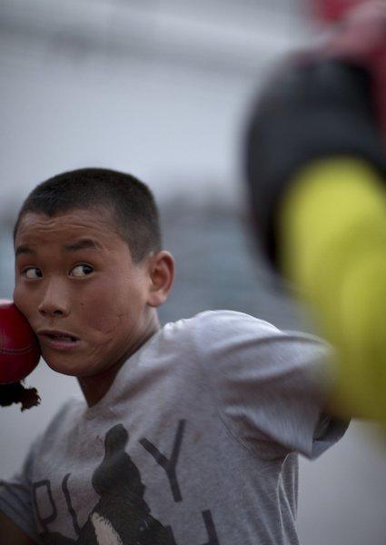 Rao Kuncheng, 13, in technical training, April 18, 2013. (Xinhua/Fei Maohua)