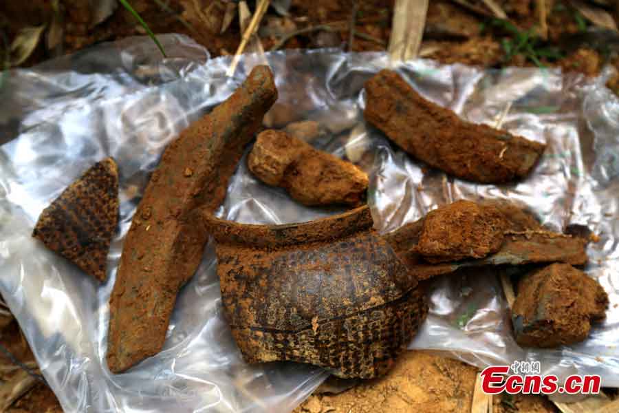 Bricks with patterns are found in an ancient tomb dating back to the Eastern Han Dynasty (25 AD-220 AD) in Gongqingcheng, Jiangxi Province, May 6, 2013. Burial objects including pieces of pottery and ironware were discovered in the tomb.(CNS/Liu Zhijian)