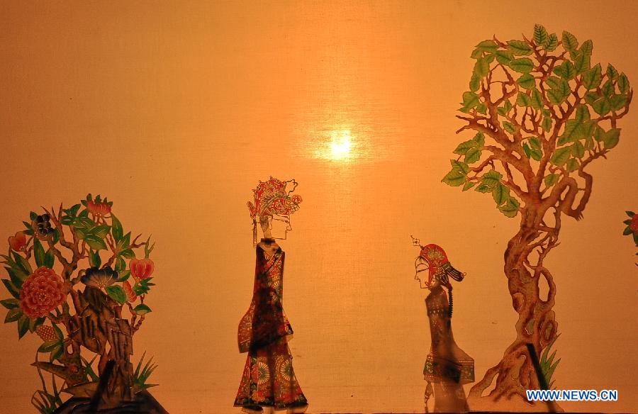 Figures of Daoqing (a folk operetta originated from the chanting of Taoist scriptures) shadow play are seen at a troupe in Huanxian County, Qingyang, northwest China's Gansu Province, May 8, 2013. Huanxian County, which locates in the east of Gausu Province, boasts its Daoqing shadow play. The art form is popular among local residents for its attractive performance. (Xinhua/Guo Gang)