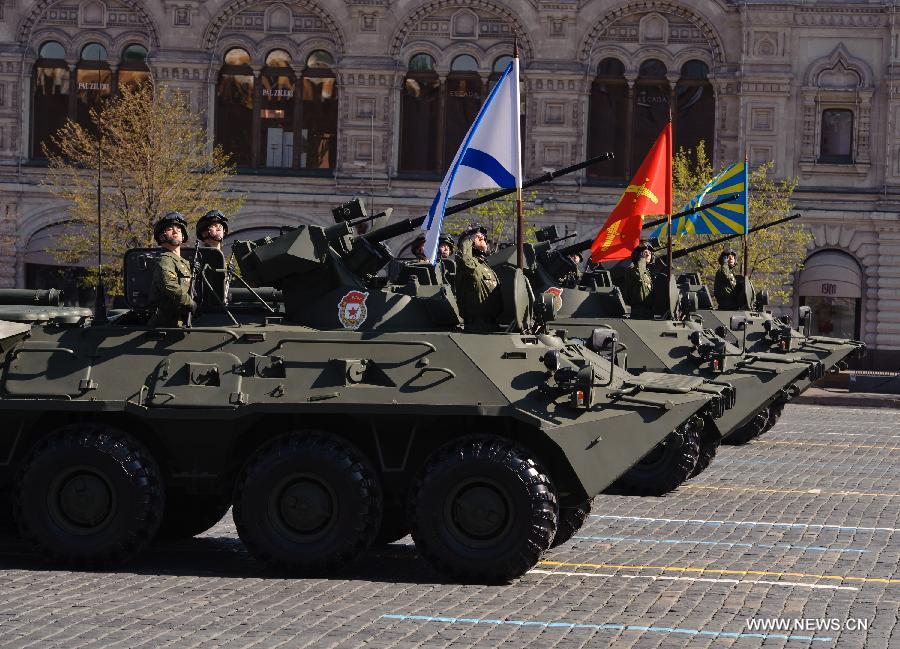 Russian armored personnel carriers take part in a Victory Day parade at the Red Square in Moscow, Russia, on May 9, 2013. A grand parade was held on Thursday at the Red Square to mark the 68th anniversary of the Soviet Union's victory over Nazi Germany in the Great Patriotic War. (Xinhua/Jiang Kehong)