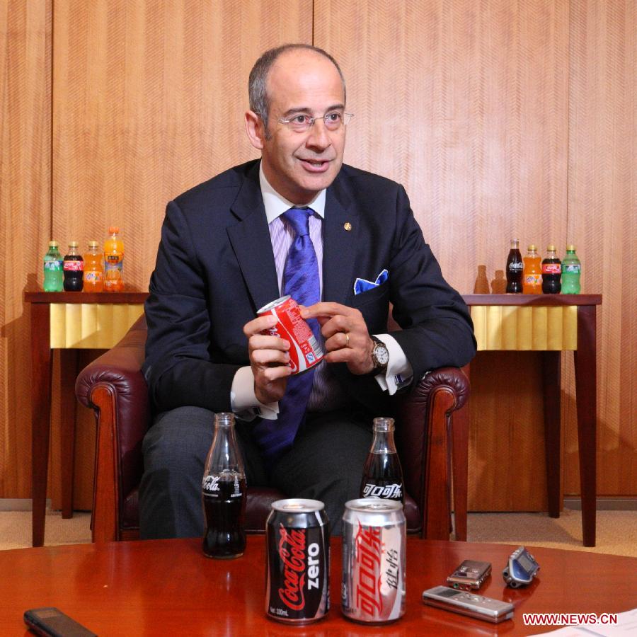 Ahmet Bozer, president of Coca-Cola International, has an interview with journalists in Beijing, capital of China, May 9, 2013. The Coca-Cola Company announced here on Thursday that it will continue to increase investment levels in China. Bozer said during an interview that 4 billion U.S. dollars of investment will be added by 2014 in China. And he explained that the investment is mixed with marketing assets like plants, transportation and retail outlets. (Xinhua/Wu Kaixiang) 