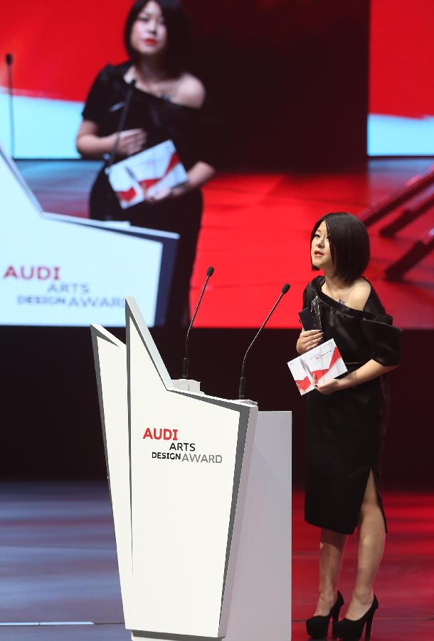 Designer Masha Ma, a winner of the 2nd Audi Arts and Design Award, delivers a prize speech during the awarding ceremony of the 2nd Audi Arts and Design Award in Beijing, capital of China, May 9, 2013. Founded in 2010, the Audi Arts and Design Award is a cross-discipline award that focuses on Chinese contemporary arts and design. (Xinhua/Meng Yongmin) 