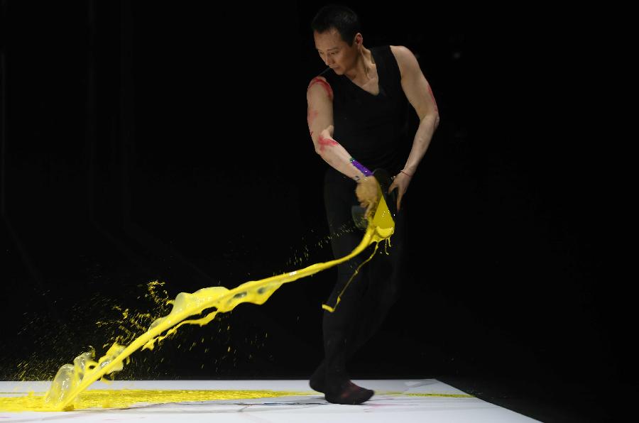 Dancer Shen Wei, who is a winner of the 2nd Audi Arts and Design Award, performs during the awarding ceremony of the 2nd Audi Arts and Design Award in Beijing, capital of China, May 9, 2013. Founded in 2010, the Audi Arts and Design Award is a cross-discipline award that focuses on Chinese contemporary arts and design. (Xinhua/Meng Yongmin) 