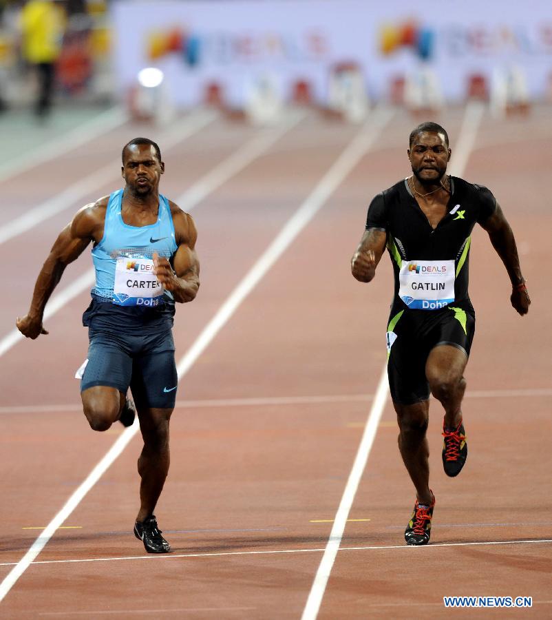 Justin Gatlin (R) of the United States runs during the men's 100m final at the IAAF Diamond League in Doha, capital of Qatar, May 10, 2013. Gatlin claimed the title of the event with 9.97 seconds. (Xinhua/Chen Shaojin) 