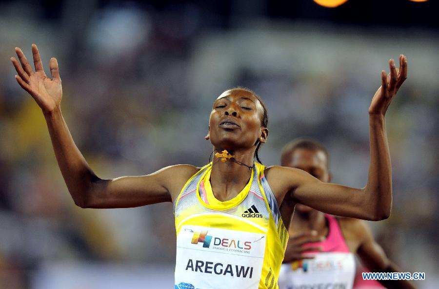 Sweden's Abeba Aregawi celebrates after the women's 1500m final at the IAAF Diamond League in Doha, capital of Qatar, May 10, 2013. Aregawi claimed the title of the event with 3 minutes and 56.60 seconds. (Xinhua/Chen Shaojin)