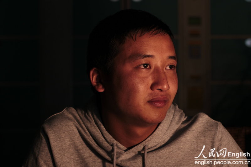Shao Yiqi, 21, comes back to old Beichuan county and becomes a security guard. Five years ago, he survived the earthquake in the Middle School of Beichuan. (Photo/CFP)