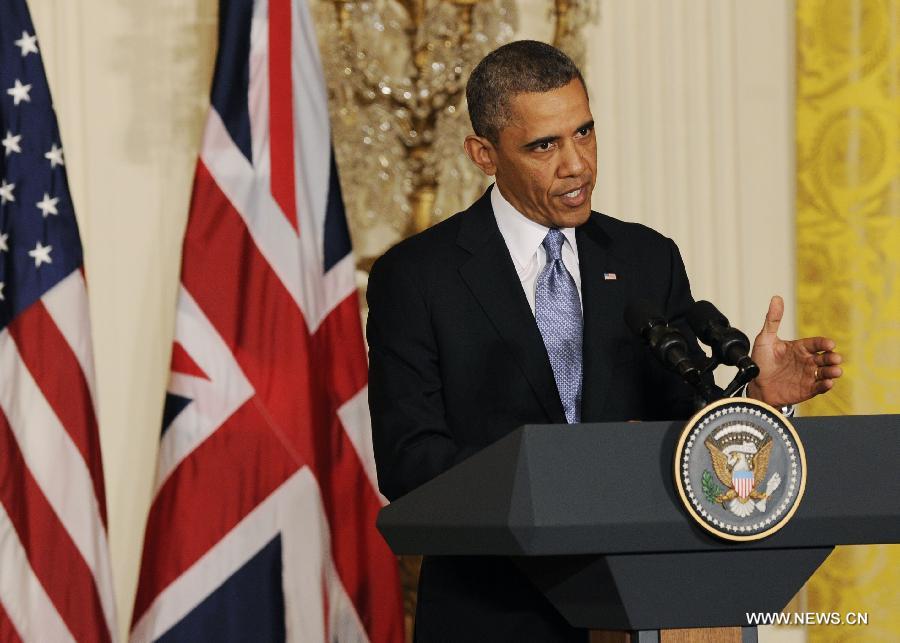 U.S. President Barack Obama speaks during a joint press conference with British Prime Minister David Cameron following their talks at the White House in Washington D.C. on May 13, 2013. (Xinhua/Fang Zhe) 