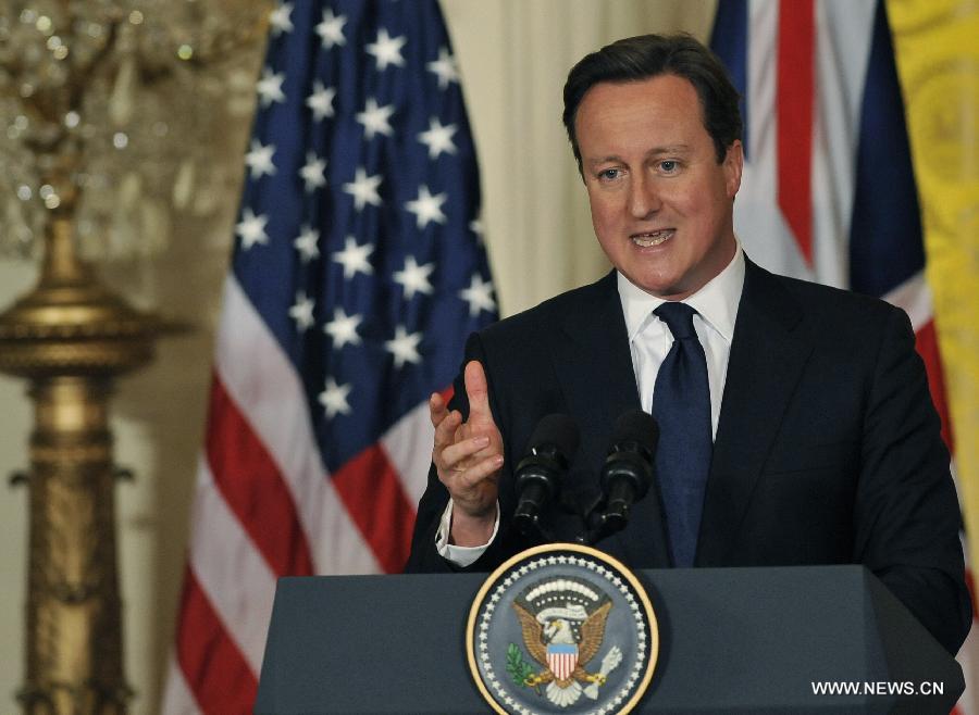 British Prime Minister David Cameron speaks during a joint press conference with U.S. President Barack Obama following their talks at the White House in Washington D.C. on May 13, 2013. (Xinhua/Fang Zhe) 