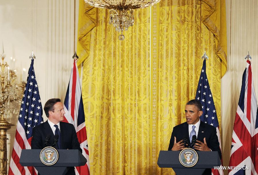 U.S. President Barack Obama (R) speaks during a joint press conference with British Prime Minister David Cameron following their talks at the White House in Washington D.C. on May 13, 2013. (Xinhua/Fang Zhe) 