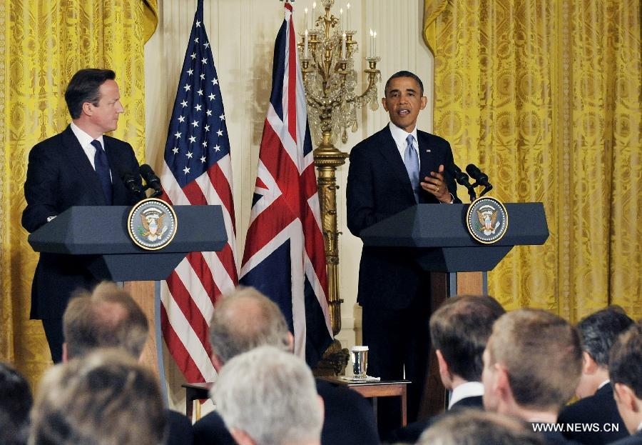 U.S. President Barack Obama (R) speaks during a joint press conference with British Prime Minister David Cameron following their talks at the White House in Washington D.C. on May 13, 2013. (Xinhua/Fang Zhe) 