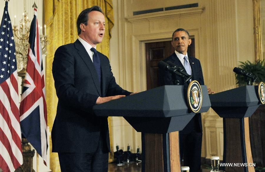 British Prime Minister David Cameron (L) speaks during a joint press conference with U.S. President Barack Obama following their talks at the White House in Washington D.C. on May 13, 2013. (Xinhua/Fang Zhe) 
