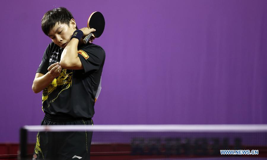 Chen Qi of China reacts during round of 64 of mixed doubles match against Steffen Mengel and Sabine Winter of Germany at Palais omnisport de Paris Bercy in Paris, France, on May 15, 2013. Chen Qi and Hu Limei won 4-3. (Xinhua/Wang Lili)