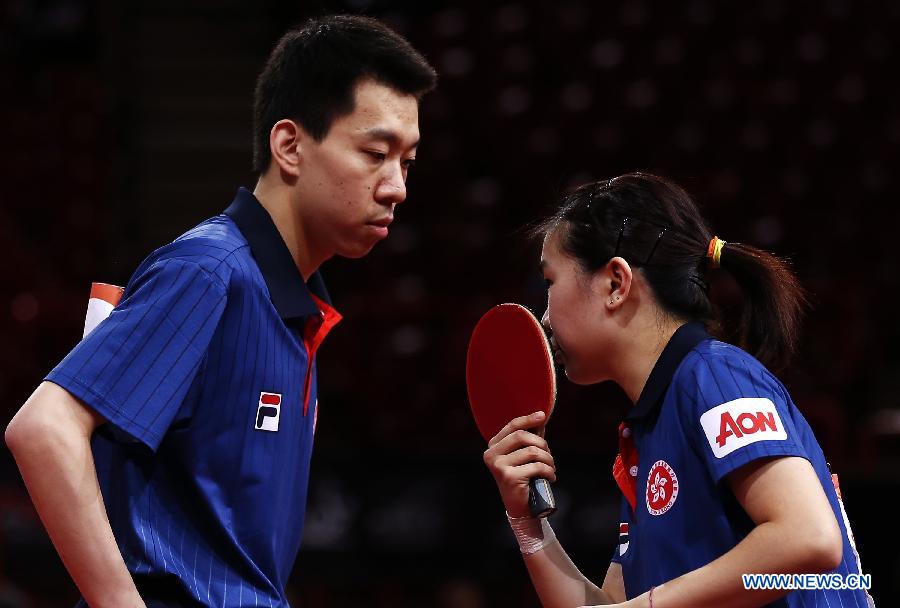 Jiang Tianyi and Lee Ho Ching (R) from Hong Kong of China compete during the round of 16 of mixed doubles against Qiu Yike (R) and Wen Jia of China at the 2013 World Table Tennis Championships in Paris, France on May 16, 2013. Qiu Yike and Wen Jia lost 2-4. (Xinhua/Wang Lili)