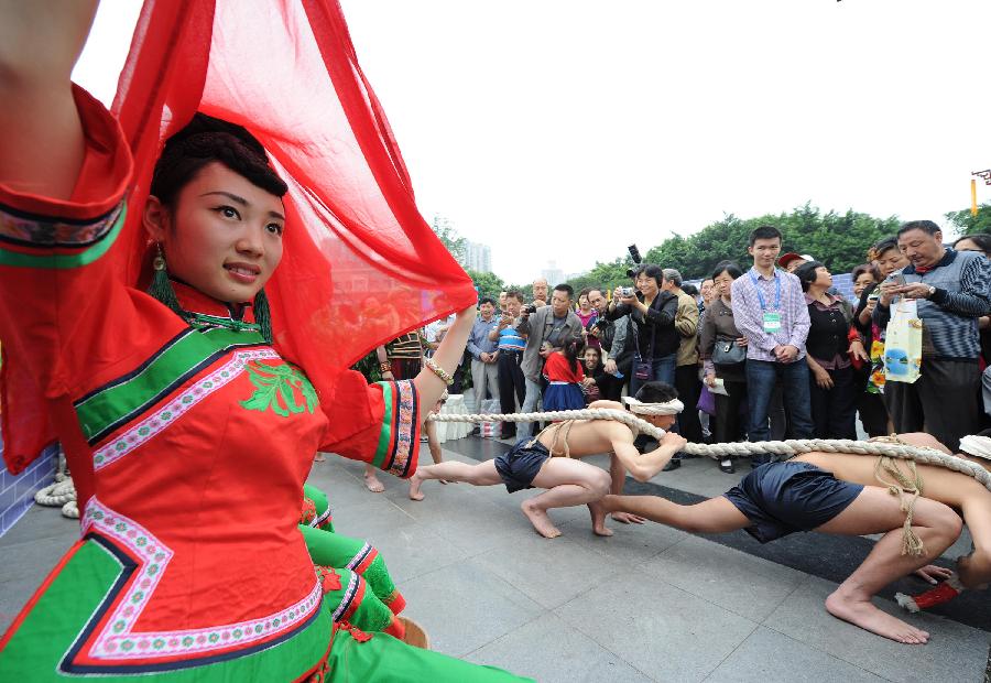 Dancers perform for the opening of the China Tourism Day and the 3rd Western China Tourism Industry Expo, in Chongqing, southwest China, May 19, 2013. Chongqing is the main venue for the 2013 China Tourism Day. (Xinhua/Li Jian)