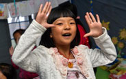 Children take dance class in temporary tent in Lushan