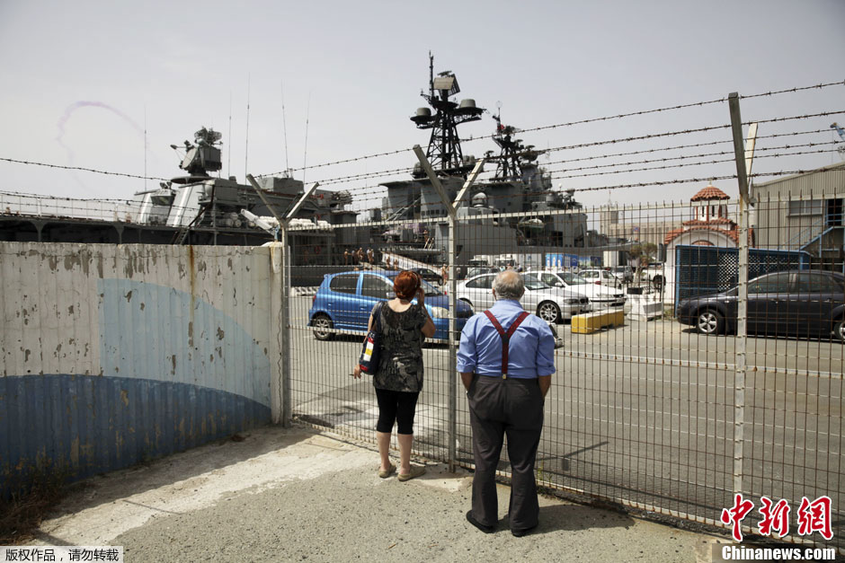 Russian sailors are seen aboad the Admiral Panteleyev Russian war ship moored at the Cypriot port of Limassol on Friday, May 17, 2013.  (Photo Source: chinanews.com)