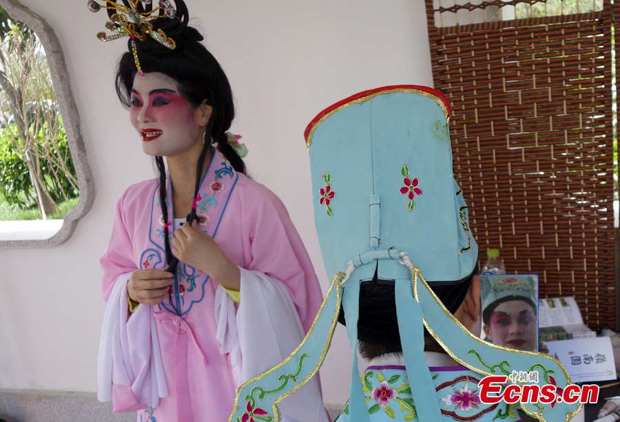 Singers perform Guangdong Opera at the Garden Expo Park in Fengtai District, Beijing, May 19, 2013. The Ninth China (Beijing) International Garden Expo kicked off on Saturday. Garden designs from 69 Chinese cities and 29 countries will be presented. (CNS/Liu Guanguan)