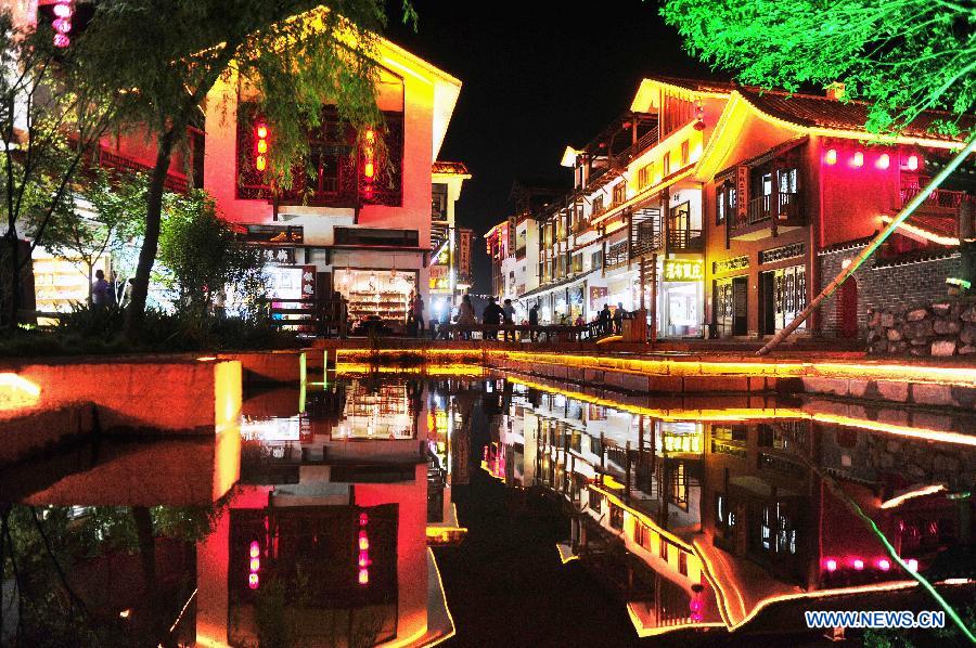 Photo taken on May 18, 2013 shows the night scene of the Xibu Street in Zhangjiajie, a well-known scenic spot in central China's Hunan Province. (Xinhua/Li Ga)