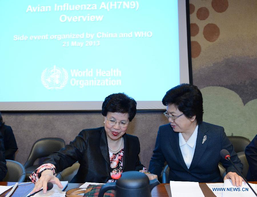 Chinese Health Mininster Li Bin (R) talks with Margaret Chan, Director-General of World Health Organization, during a side event on Influenza A (H7N9) of the 66th World Health Assembly in Geneva, Switzerland, May 21, 2013. China has gained international recognition for its immediate and effective responses to the human infections with H7N9 virus, a side event on Influenza A (H7N9) showed Tuesday. (Xinhua/Wang Siwei)