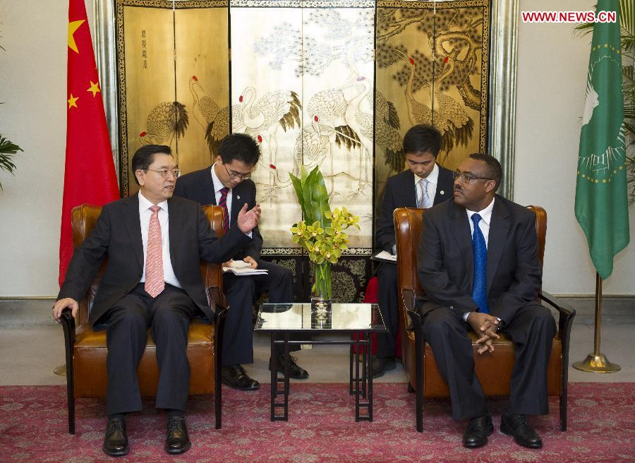 Zhang Dejiang (1st L), chairman of the Standing Committee of the National People's Congress, meets with Demeke Mekonnen (1st R), special envoy of rotating chairman of the African Union (AU) and deputy prime minister of Ethiopia, prior to a reception held by the African Diplomatic Corps in China to mark the 50th founding anniversary of the Organization of African Unity (OAU), predecessor of the AU, in Beijing, capital of China, May 25, 2013. (Xinhua/Xie Huanchi)