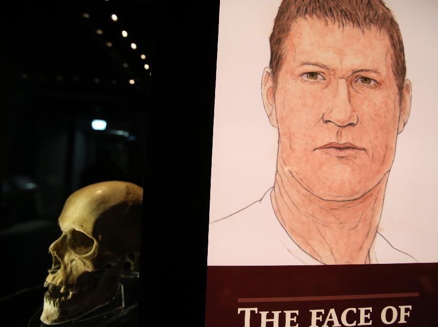A skull and its facial reconstruction is seen at Mary Rose museum in south England's Portsmouth, April 25, 2013. The Mary Rose museum opened here on May 31, 2013. The new museum, at the historic dockyard in Portsmouth and in the shape of the bow of a black ship, was aimed at taking visitors to a journey through 500 years, so as to learn the story of the Mary Rose, one of the largest and most famous ships in the English navy. (Xinhua/Yin Gang) 