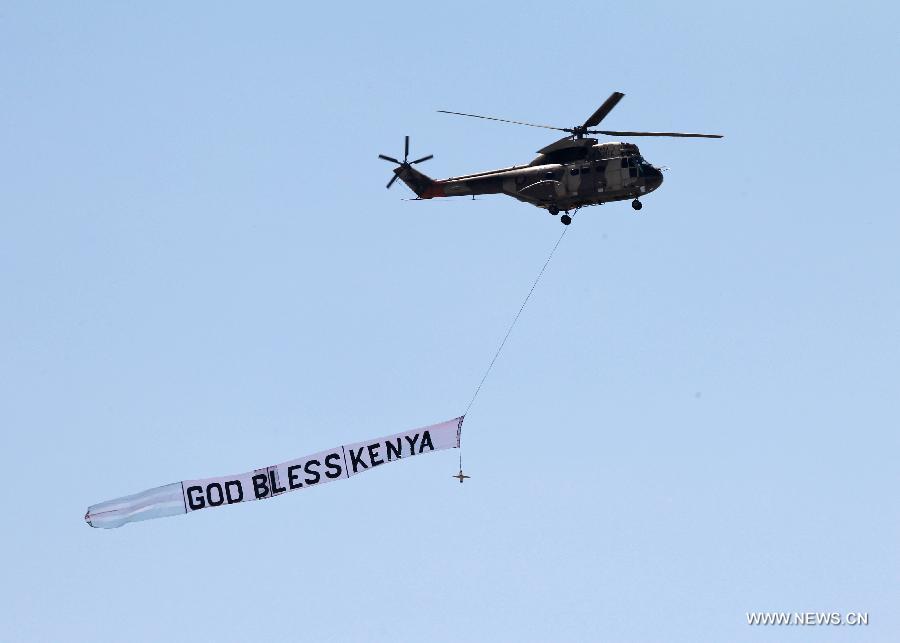 A helicopter of the Kenyan Air Force flies during a military parade to celebrate the 50th Madaraka Day in Nairobi, capital of Kenya, June 1, 2013. Kenya formed its self-government and attained the right to manage its own affairs from British colonialists on June 1, 1963. (Xinhua/Meng Chenguang) 