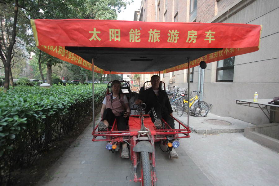 On May 25 in Shenyang, a couple in their 60's set out from their home to begin a worldwide tour on a specially-designed solar pedicab. The couple's plan is to visit over 100 countries in five years. The decision to embark on this unique journey was inspired by the couple’s new interpretation on life after traveling all over China. [Photo/China Daily]