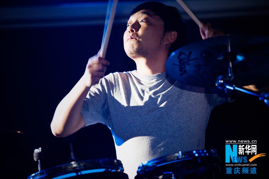 A drummer plays music. (Photo/Xinhua)